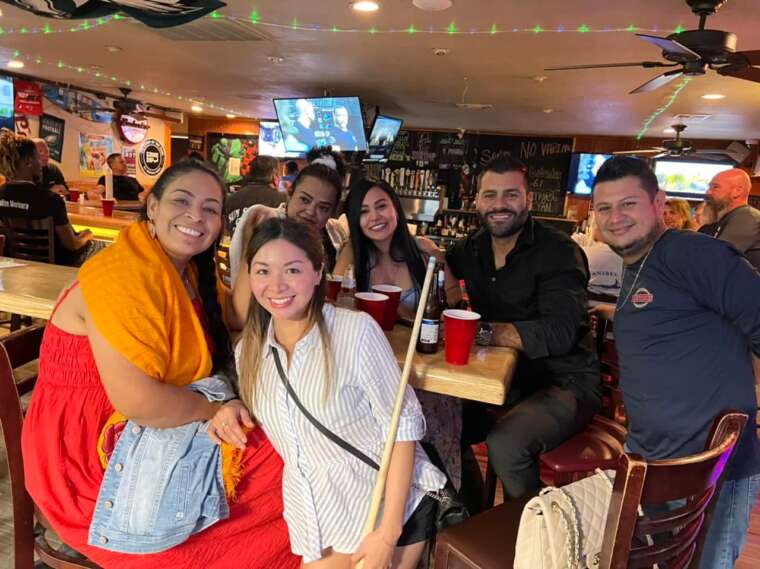 group of people at the bar Busters Sports Tavern